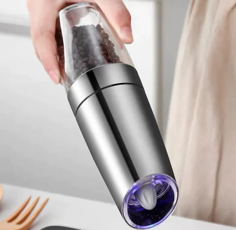 Electric pepper grinder in use